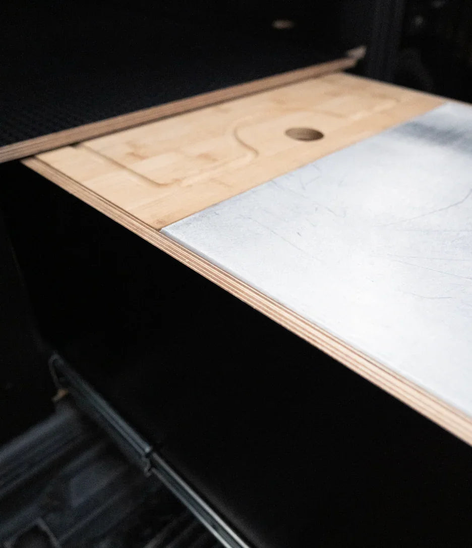 Close-up of custom wooden and metal vehicle drawer system for organized storage