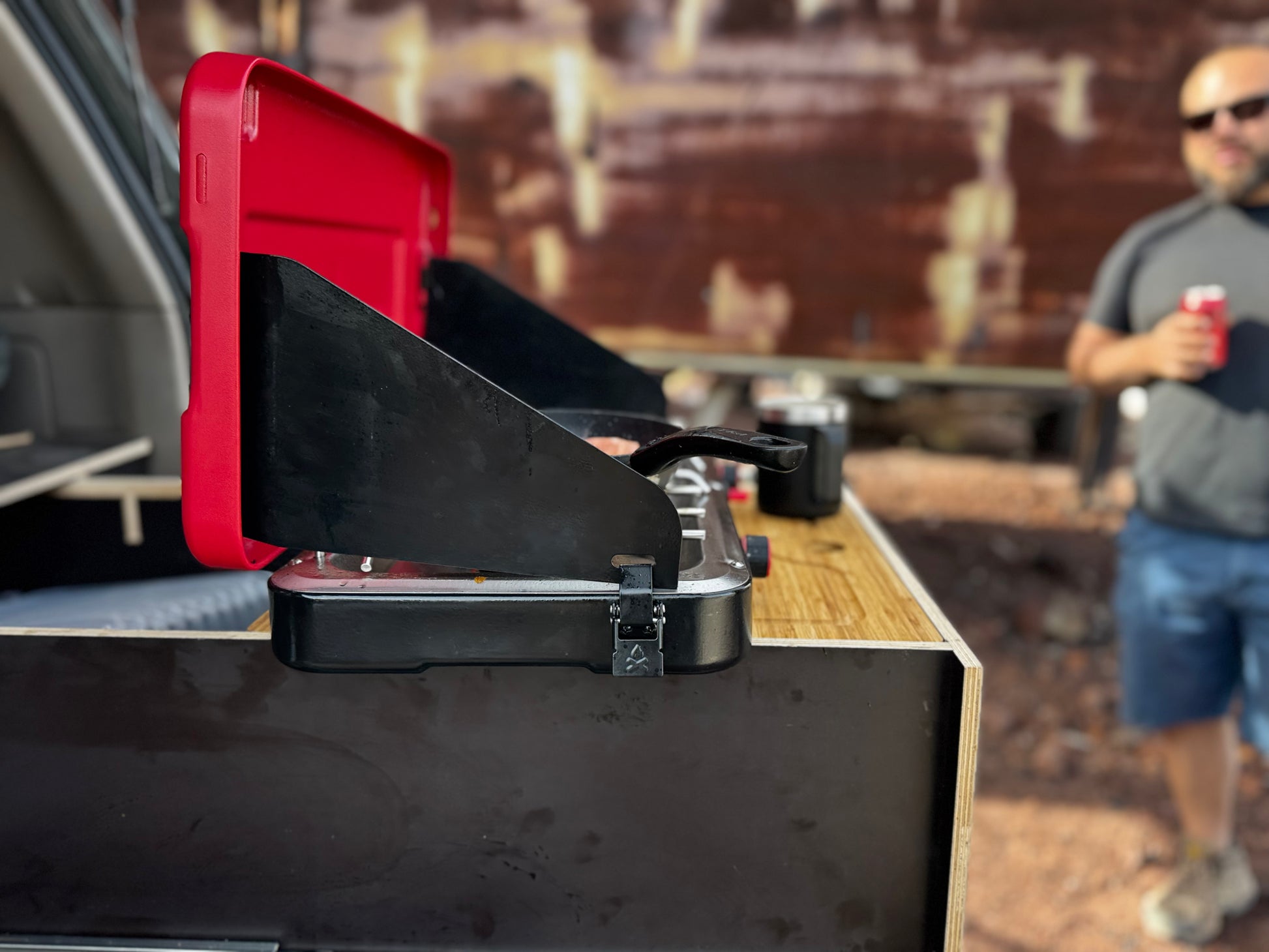 Vehicle drawer system with portable camping stove setup outdoors