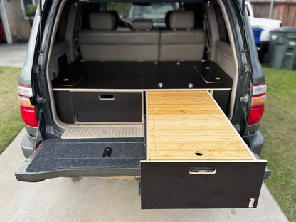 Custom wood drawer storage system installed in SUV cargo area, drawer extended
