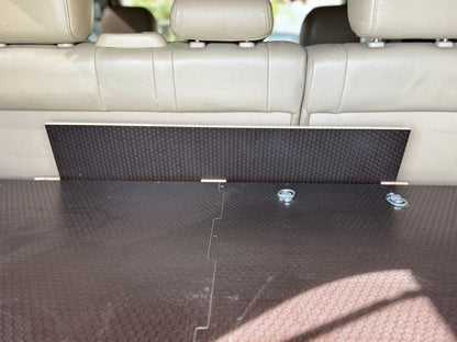 Vehicle trunk with custom wood storage drawer system and tie-down anchors