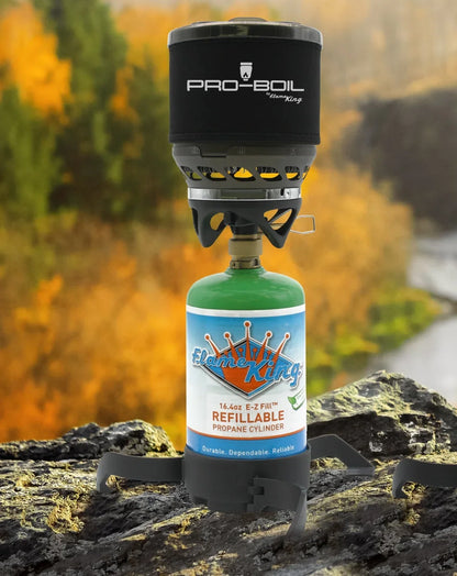 Pro-Boil camping stove on a Flame King refillable propane cylinder atop a rocky surface.